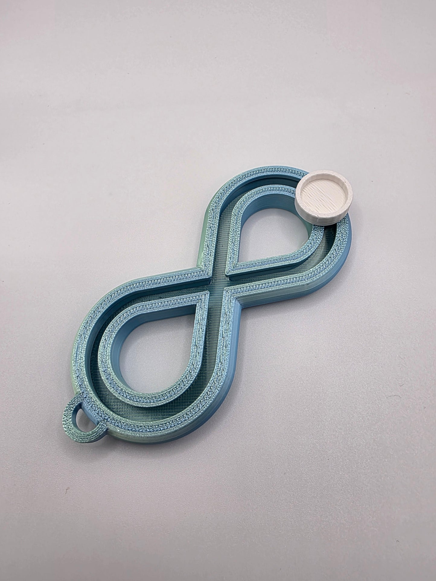 3dFidgets - Infinite Breath a soothing, figure-eight fidget tool designed to help you slow down, regulate your breathing, and find calm anytime, anywhere