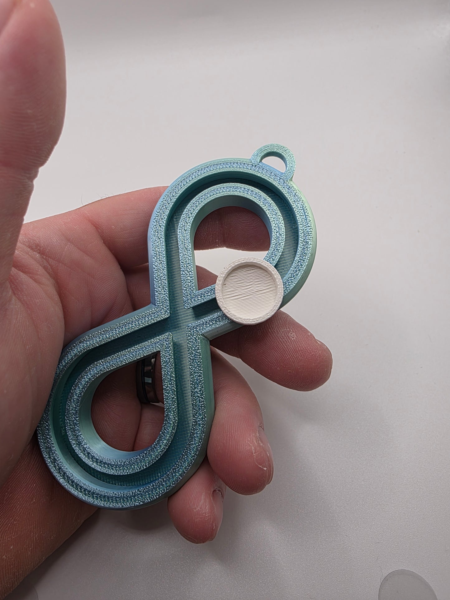 3dFidgets - Infinite Breath a soothing, figure-eight fidget tool designed to help you slow down, regulate your breathing, and find calm anytime, anywhere