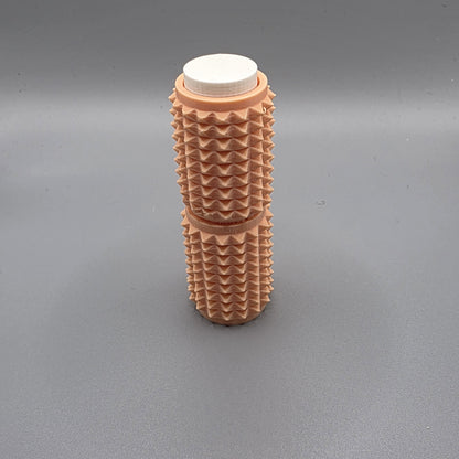 A textured, ribbed plastic cylindrical container with a white screw-on cap, standing upright on a neutral gray background.